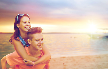Image showing happy teenage couple having fun on beach