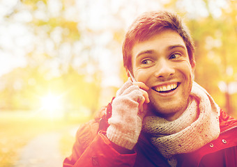 Image showing man with smartphone calling on city street