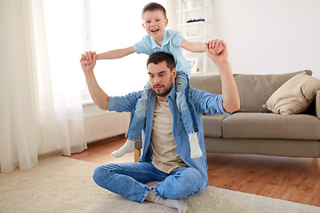 Image showing father with son playing and having fun at home