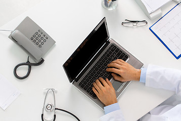 Image showing doctor hands typing on laptop at clinic