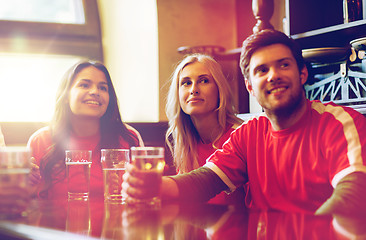 Image showing fans or friends watching football at sport bar