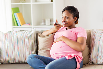 Image showing pregnant woman using voice recorder on smartphone