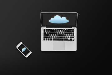 Image showing laptop computer with cloud icon and smartphone