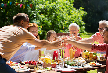 Image showing happy family having dinner or summer garden party