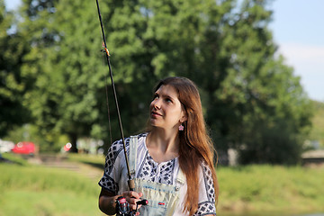 Image showing summer sprouts and dungarees while fishing