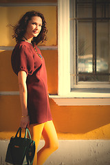 Image showing beautiful woman with a burgundy dress 