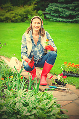 Image showing woman working in a flower garden