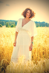 Image showing beautiful woman in white dress in a field outdoors on a summer d