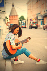 Image showing beautiful european woman with guitar