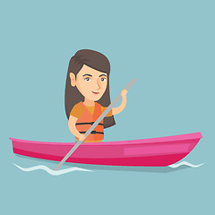 Image showing Young caucasian woman travelling by kayak.