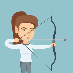 Image showing Young caucasian archer training with a bow.