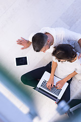 Image showing couple using tablet and laptop computers top view