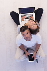 Image showing couple using tablet and laptop computers top view