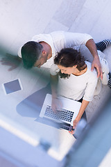 Image showing couple using tablet and laptop computers top view