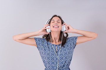 Image showing woman with headphones isolated on a white