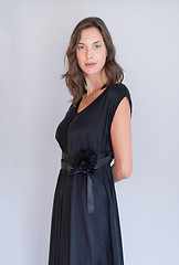 Image showing woman in a black dress isolated on white background