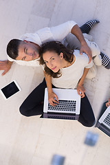 Image showing couple using tablet and laptop computers top view