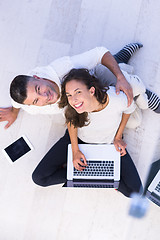 Image showing couple using tablet and laptop computers top view