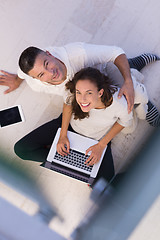 Image showing couple using tablet and laptop computers top view