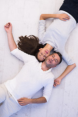 Image showing handsome couple lying on floor