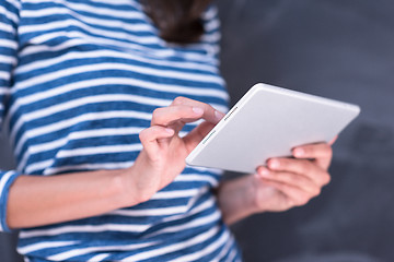 Image showing woman using tablet  in front of chalk drawing board