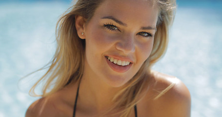 Image showing Cheerful model posing in pool