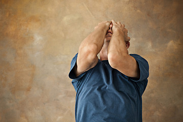 Image showing Worried mature man touching his head.