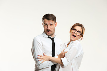 Image showing The business man and woman communicating on a gray background