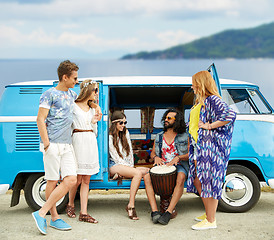 Image showing hippie friends with tom-tom playing music over car