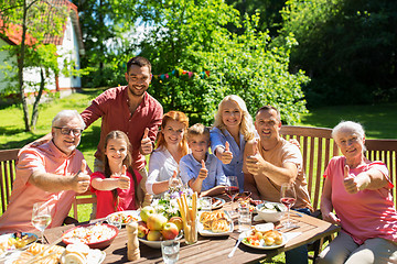 Image showing happy family having dinner or summer garden party