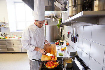 Image showing male chef cooking food at restaurant kitchen