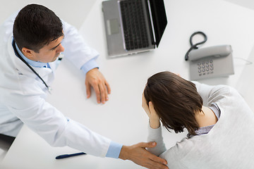 Image showing doctor with laptop and woman patient at hospital