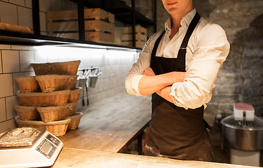 Image showing chef or baker in apron at bakery kitchen