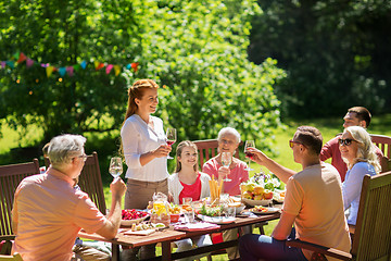 Image showing happy family having dinner or summer garden party