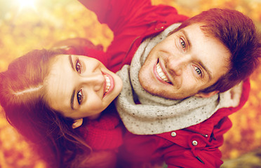 Image showing close up of happy couple taking selfie at autumn
