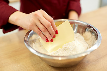 Image showing chef with flour in bowl making batter or dough