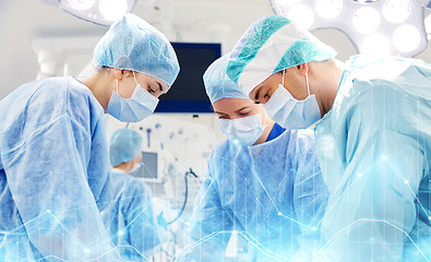 Image showing group of surgeons in operating room at hospital