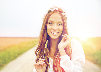 Image showing smiling young hippie woman on cereal field