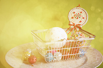 Image showing Christmas balls in shopping basket, retro toned