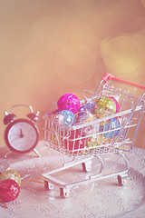 Image showing Christmas decorations in shopping trolley, retro toned