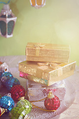 Image showing Christmas toys, lights and golden presents, retro toned