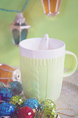 Image showing Cup and christmas toys, retro toned