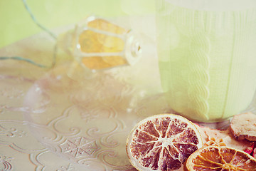 Image showing Cup, christmas light bulb and cuted fruits, retro toned