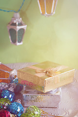 Image showing Christmas lights and golden presents, retro toned