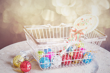 Image showing Christmas toys in shopping basket, retro toned