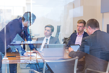 Image showing Business people sitting and brainstorming at corporate meeting.