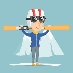 Image showing Young caucasian sportswoman holding skis.