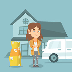 Image showing Young caucasian woman moving to a new house.