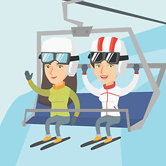 Image showing Two caucasian skiers using cableway at ski resort.