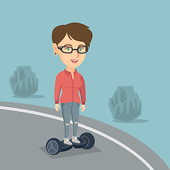 Image showing Woman riding a self-balancing electric scooter.